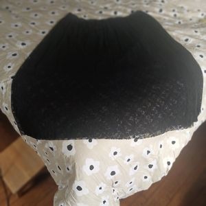 Knee length with maxi length, pleated lace over. Stretchy waist.